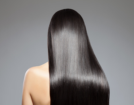 Back view of a woman with long straight hair